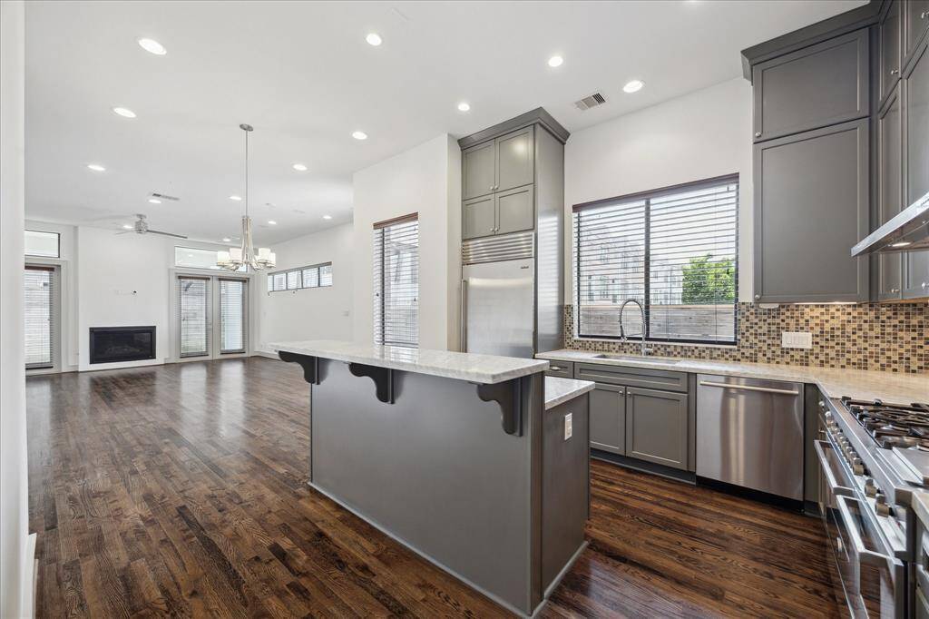 Kitchen with center island, room for bar stools, breakfast bar.
