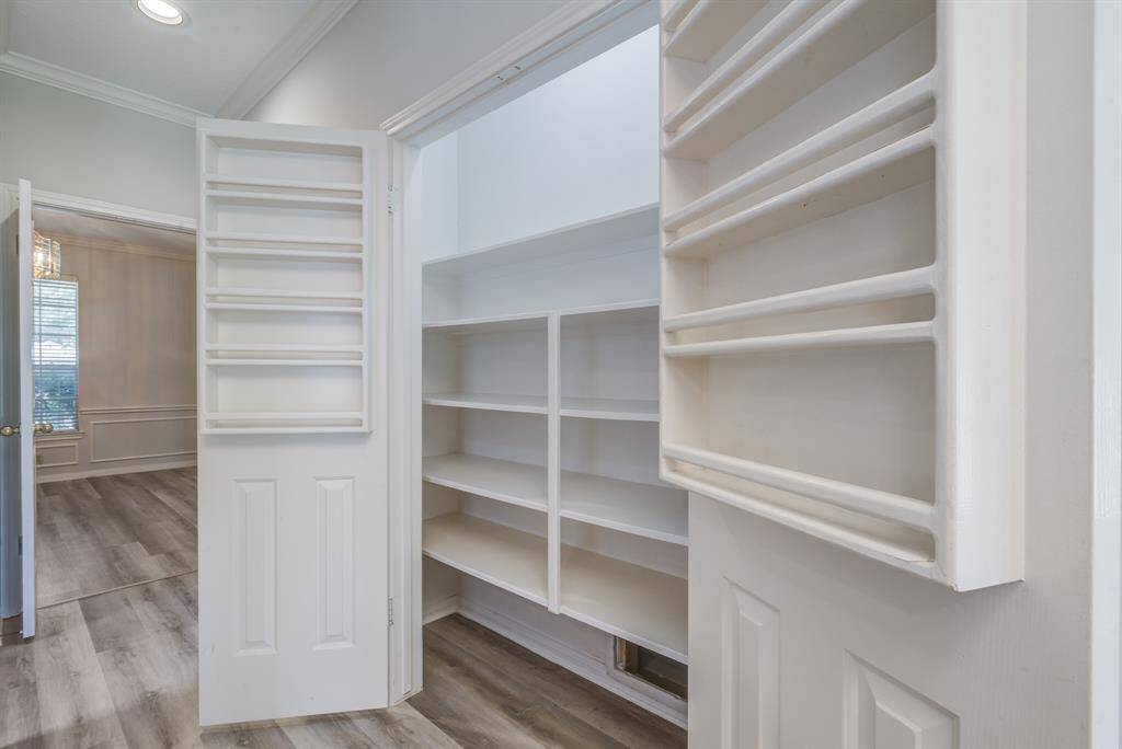 Check out this awesome panty with built in spice shelves in the doors and additional built in shelving for great organization and easy access.