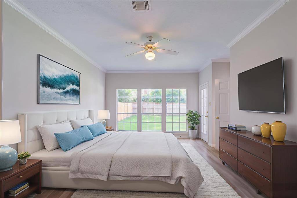 Virtually Staged. Primary bedroom is spacious and located on first level at rear of the home. Great for step free first level living.