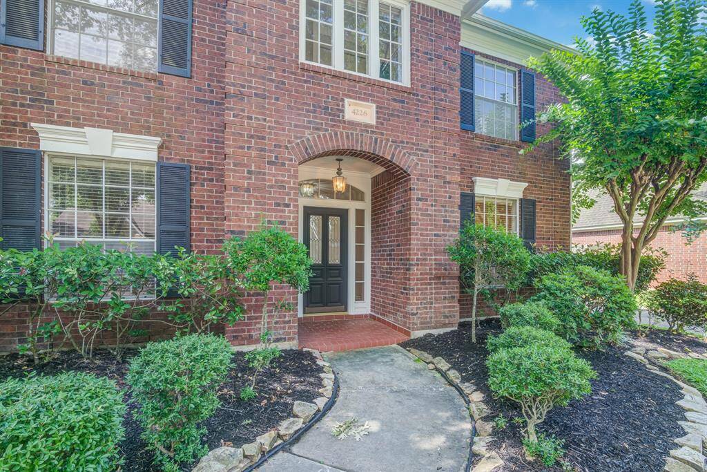 Stately looking home with grand entryway.