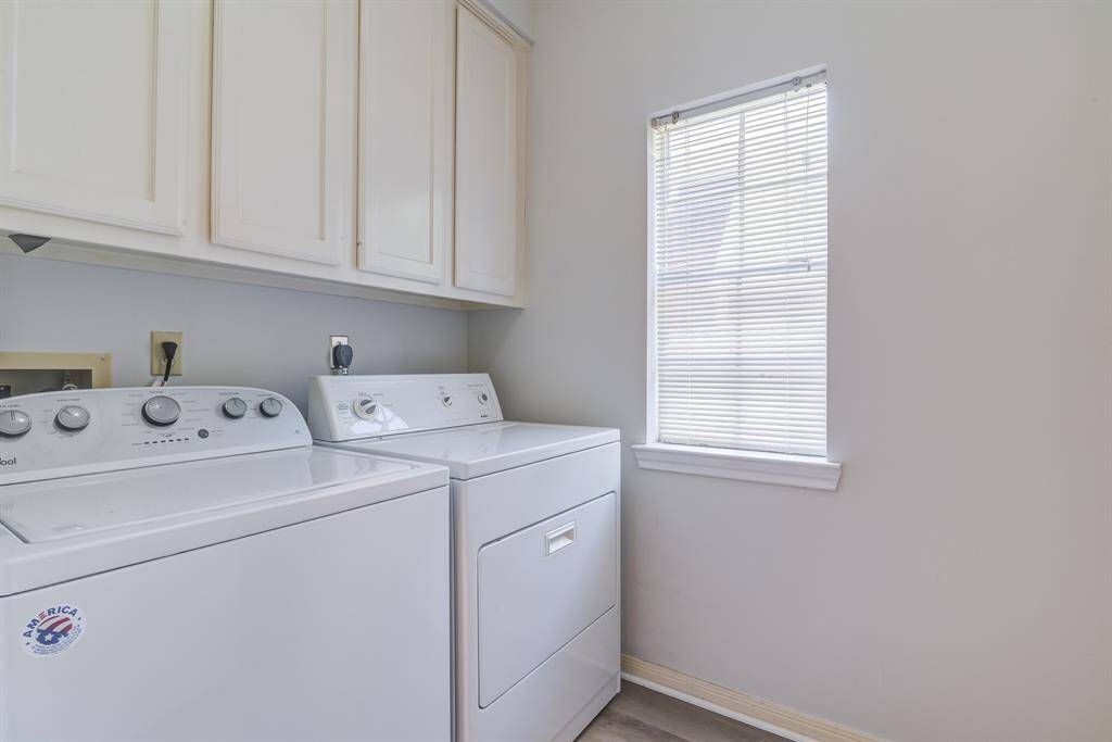 First level laundry room with extra storage and space.