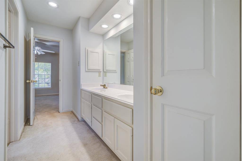 Dual sink. vanity in this Jack'n'Jill shared bathroom.