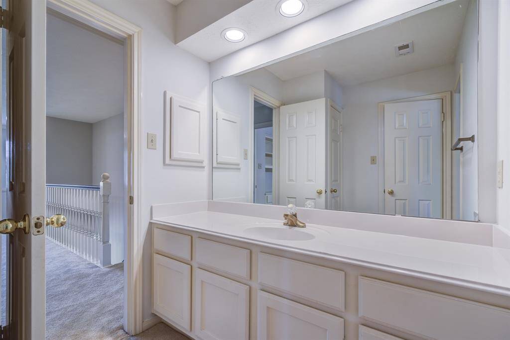 Two bathrooms on this second level each connecting to bedrooms.
