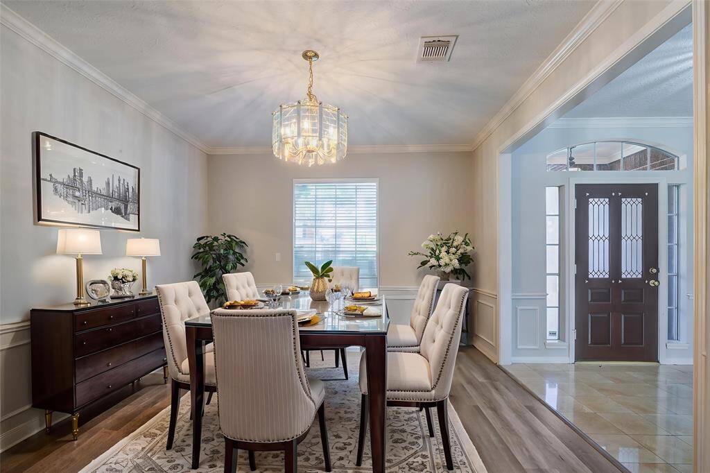 Virtually Staged. Enjoy entertaining in this elegant formal dining space with room for a large table.