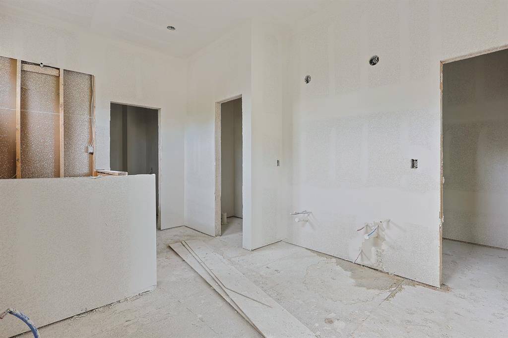 This spacious primary bathroom is taking shape to include a walk-in shower, a separate soaking tub, and double sinks—designed for both comfort and style. Soon, it will offer a spa-like retreat with plenty of room to relax and refresh every day.