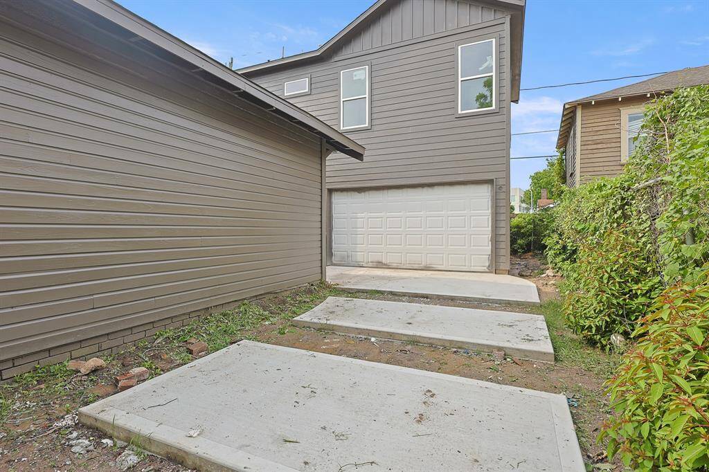 Conveniently located toward the back of the home, the attached garage is thoughtfully tucked away to maintain the clean, modern curb appeal while providing easy access and ample parking space. A smart design choice that blends functionality with style.