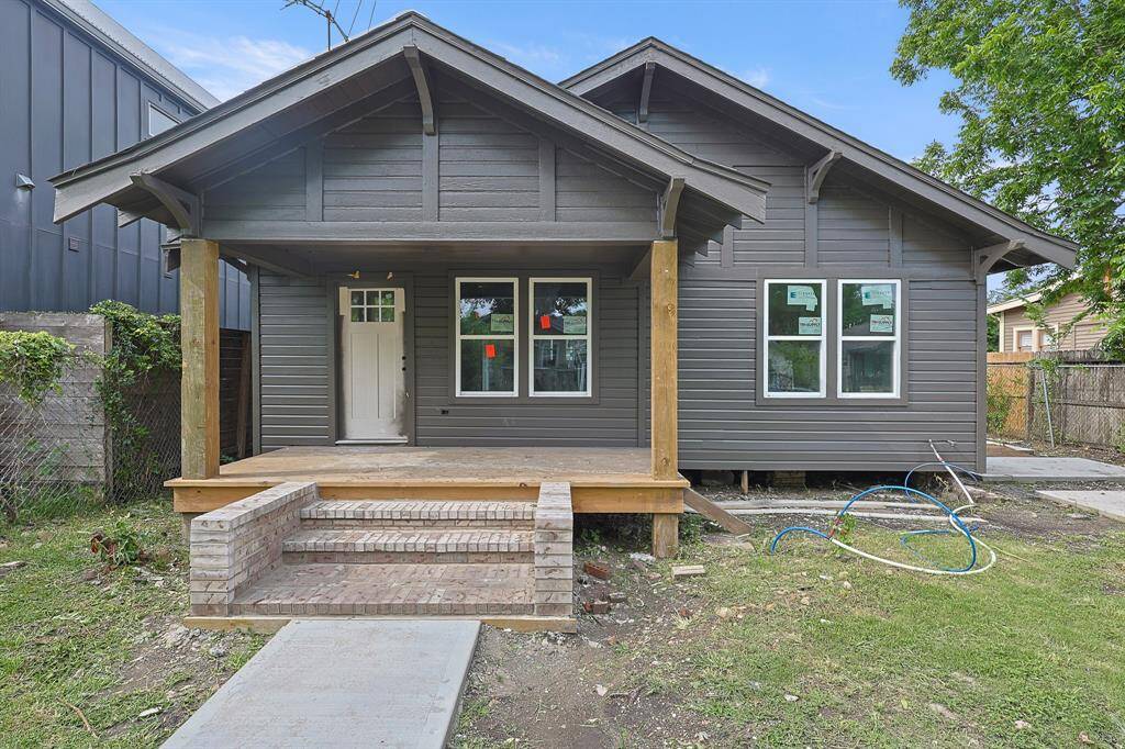 The covered front porch is taking shape beautifully—perfect for morning coffee or evening relaxation. Framed by the home’s striking black exterior and brick steps, this space sets the tone for what’s to come inside. A warm welcome with character and curb appeal already in progress!