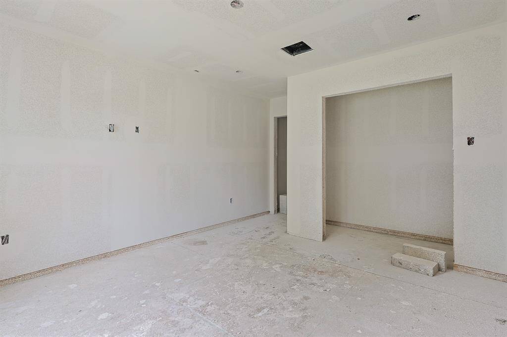 Current progress as of June 2025.  Located near the first bedroom at the front of the home, this secondary room is framed and sheet rocked, ready for transformation. With great natural light and a functional layout, this space is ideal for a child’s room, guest suite, or flex space to fit your lifestyle. A perfect blend of comfort and convenience in the making!