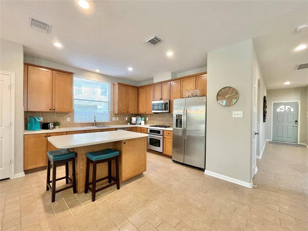 Open kitchen overlooks family room
