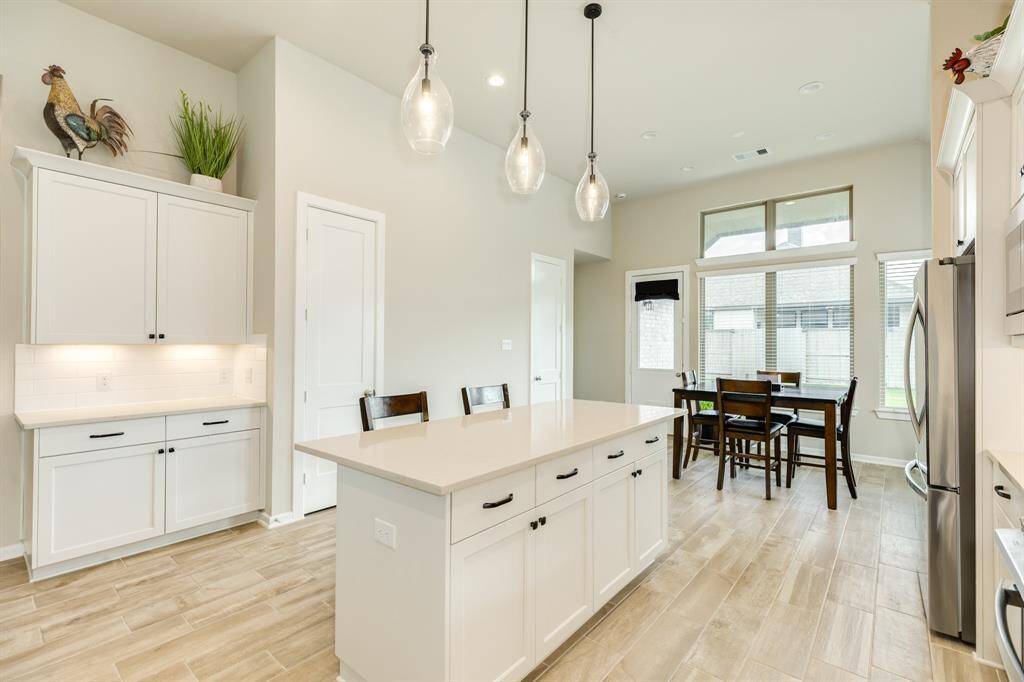 The dining area, with its many windows, and its double pantry and drink bar, provides a lot of space for entertaining.