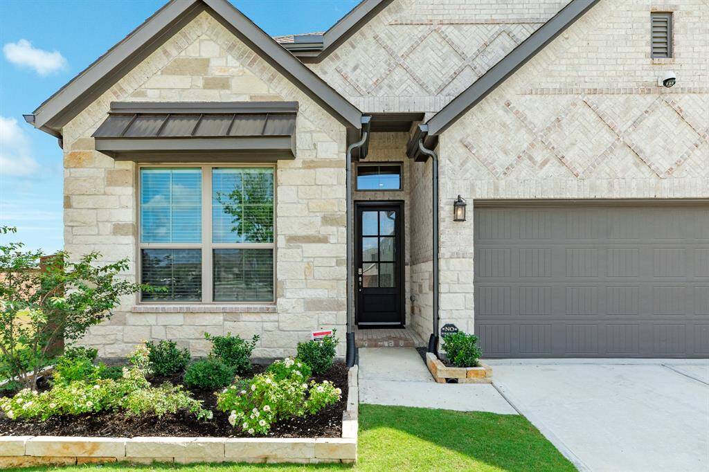 all brick home greenspace on one side
