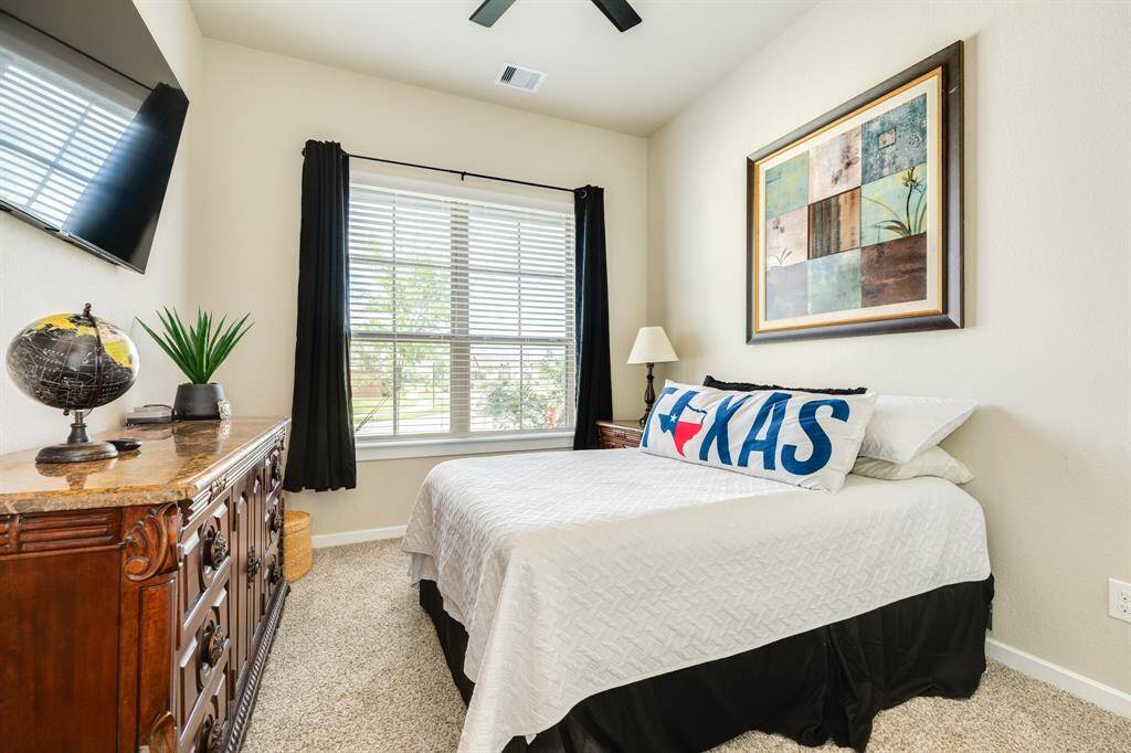 When you turn down the hallway, the first bedroom is on the left  it has a window that lets in a lot of light.