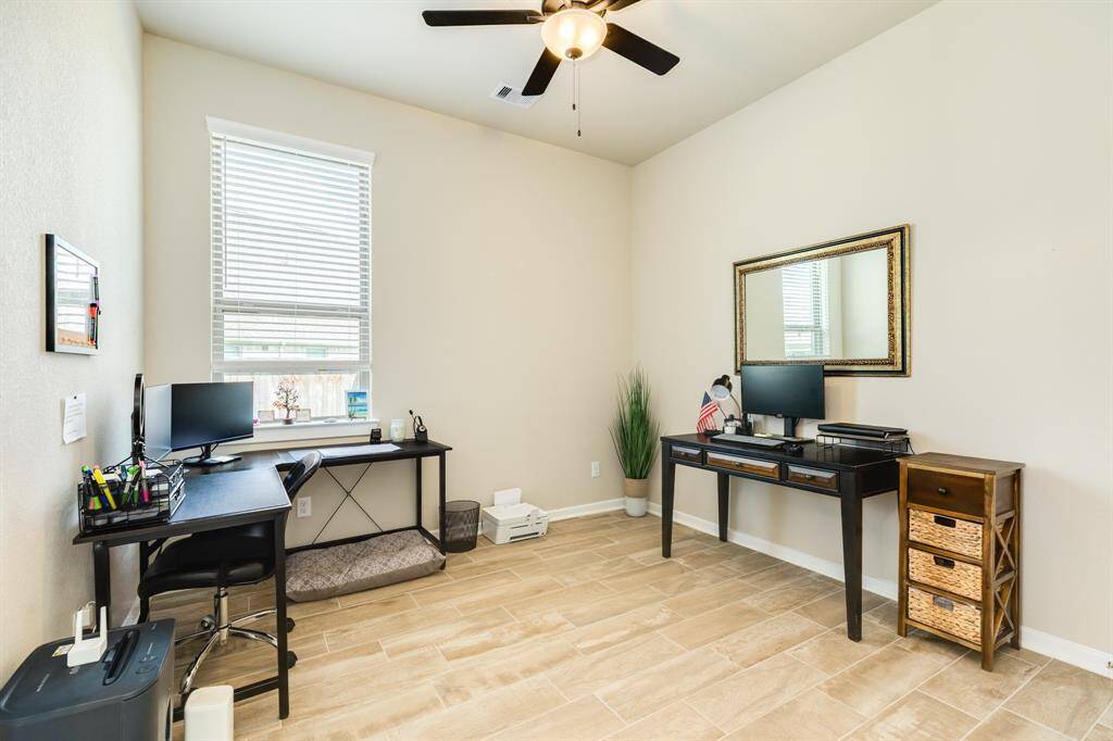 bedroom 4 has tile flooring and double doors