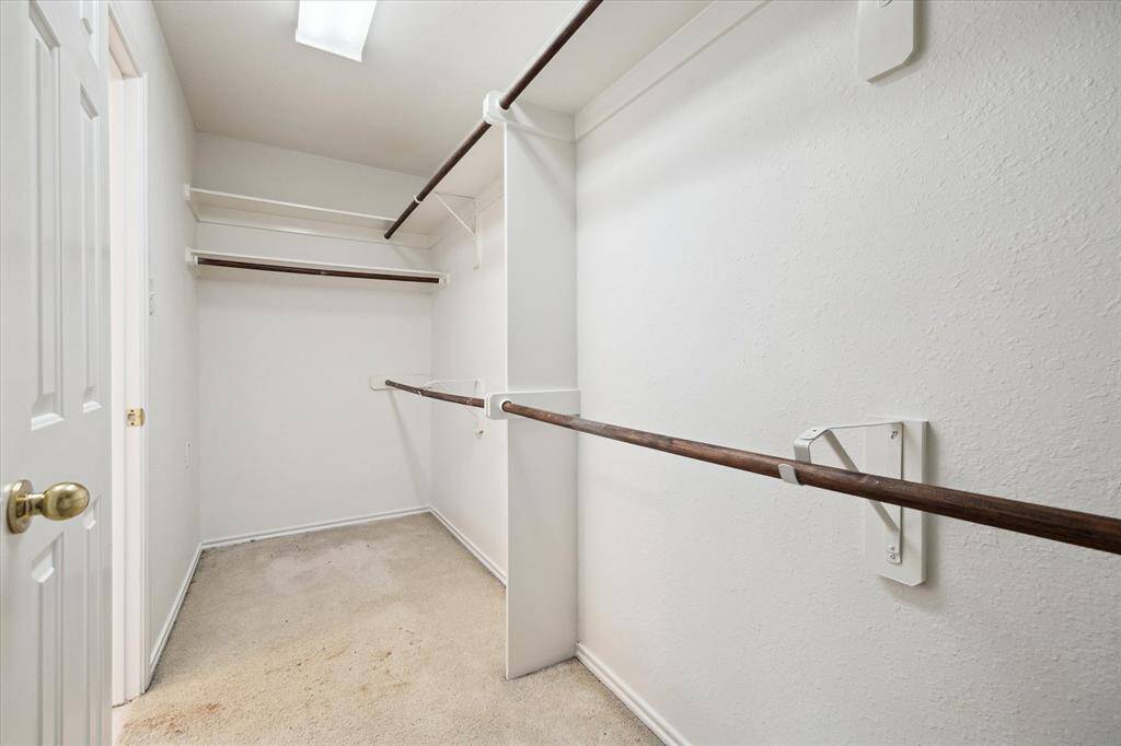 Primary bedroom walk in closet with great space