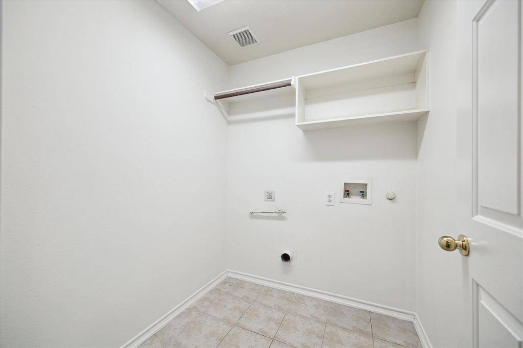 The home includes a dedicated laundry room for added convenience