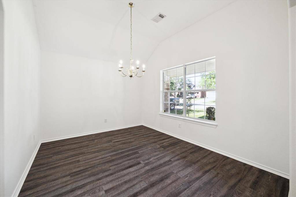 This flexible space shines with natural light and can serve as a formal dining room or a bright, functional home office, perfectly suited to your lifestyle.