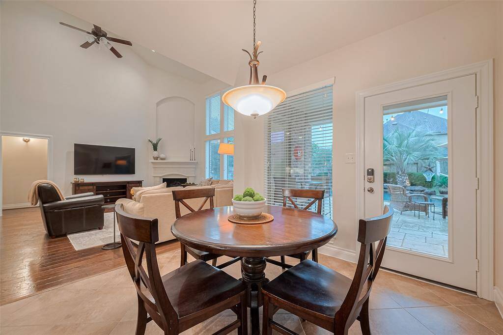 Open to both the kitchen and family room, this flexible morning area is perfect for casual meals, homework sessions, or coffee with a view of your backyard retreat