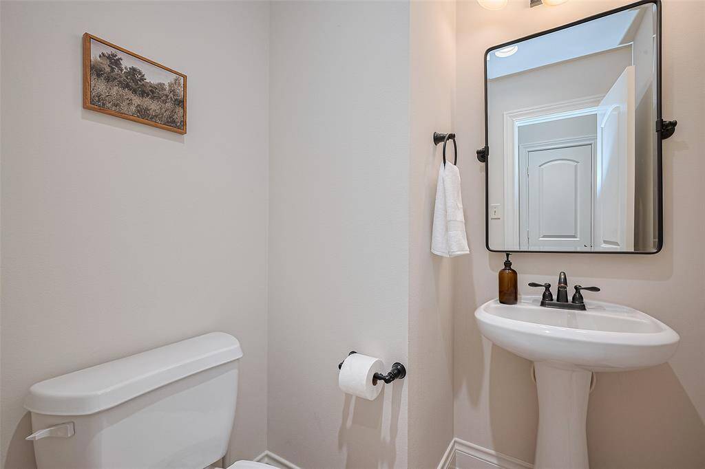 Powder room conveniently located downstairs