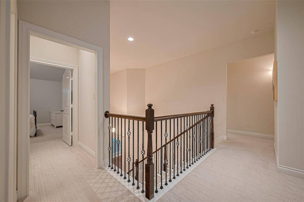 Opposite view looking towards a hallway leading to the two other secondary bedrooms