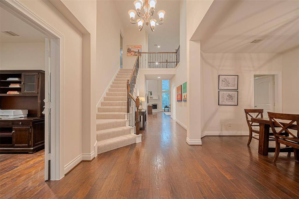 The impressive formal entry showcases rich, warm wood flooring that extends through most of the main level – home is neutral throughout and ready for your personal touches