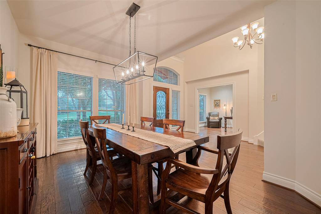 The spacious, open design of the formal dining room enhances its welcoming feel, making it perfect for entertaining