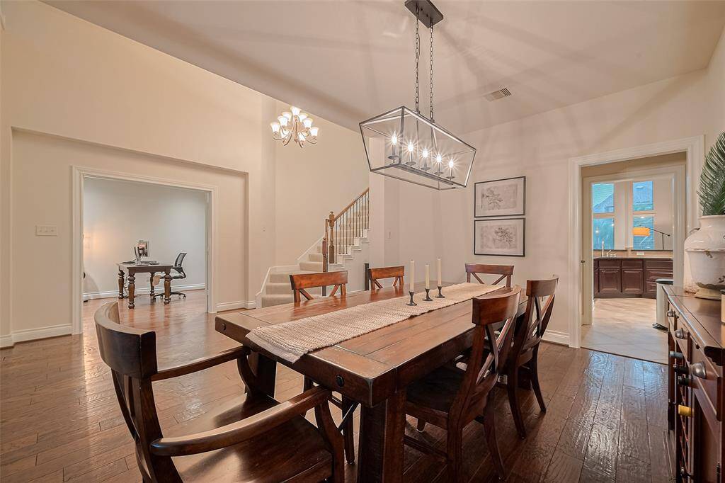 The formal dining room provides an ideal setting for hosting large gatherings, with the added convenience of direct access to the kitchen