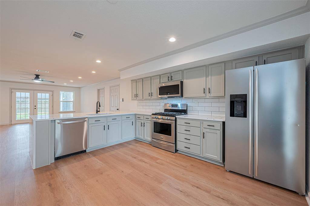Extra large kitchen with all new appliances and quartz waterfall countertop!