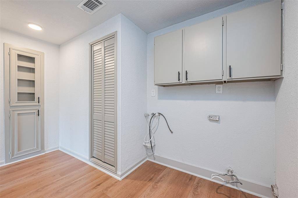 laundry room with extra storage