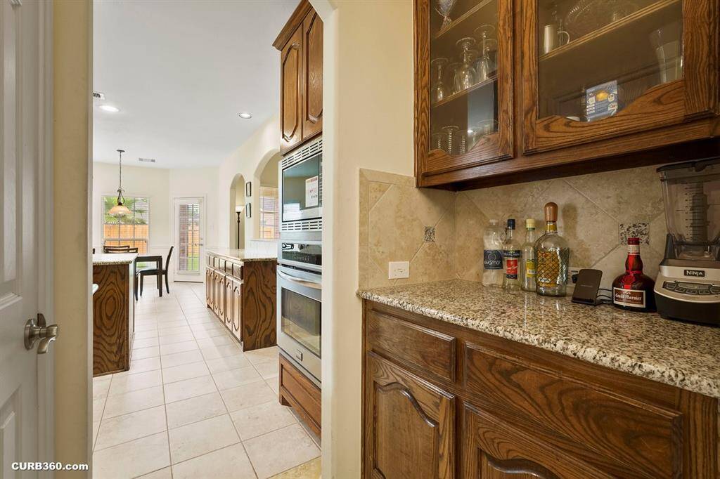Butler's pantry with granite countertops