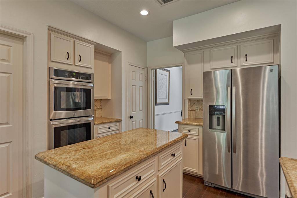 Kitchen Island, Double ovens. Door to Laundry and entry to Home Office/Study to left of refrigerator.