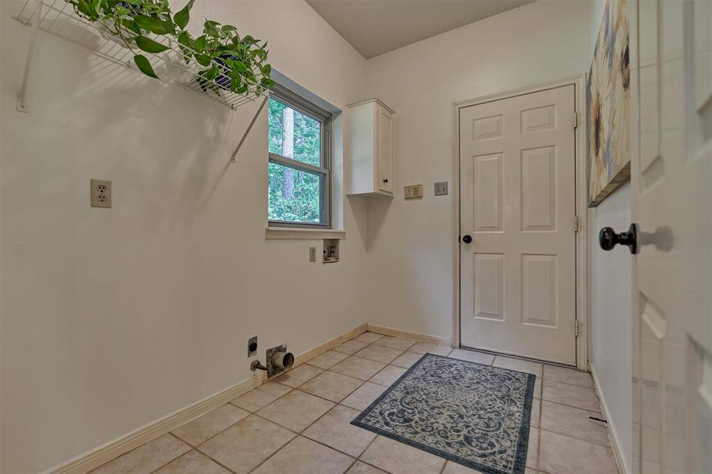 Laundry area off Kitchen. Door leads to two-car garage.