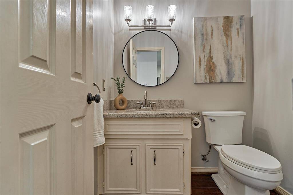 Half Bath with granite counter top. Downstairs.
