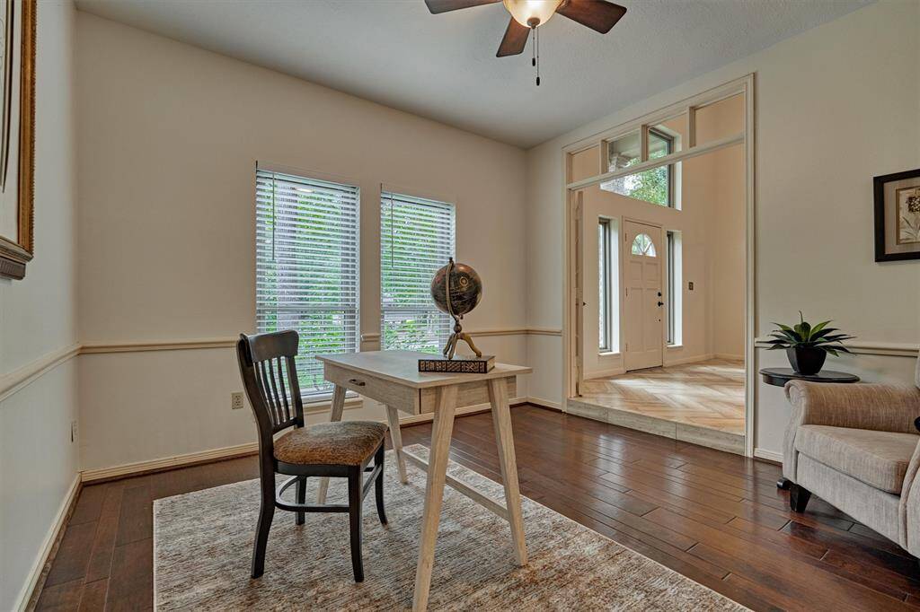View of Home Office/Study from Kitchen. Windows at front of home. Notice the transom over double door entry.