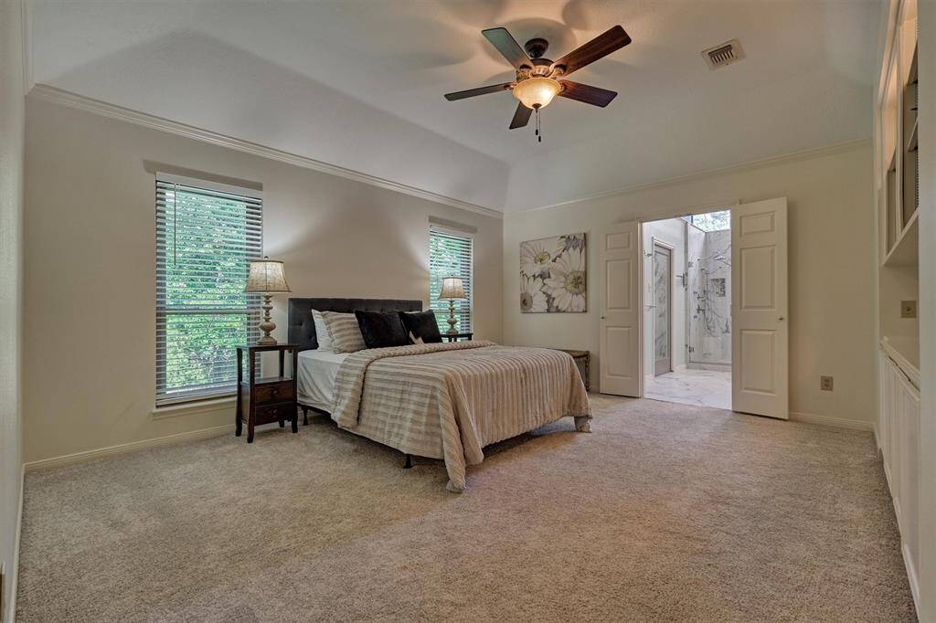 Large Primary Bedroom with sloped ceiling and luxurious ensuite Bath. Upstairs.