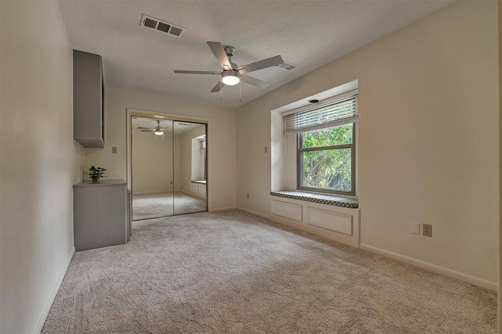 Bedroom #3 - Built in desk/shelves and window seat. Window to front of home. Upstairs.
