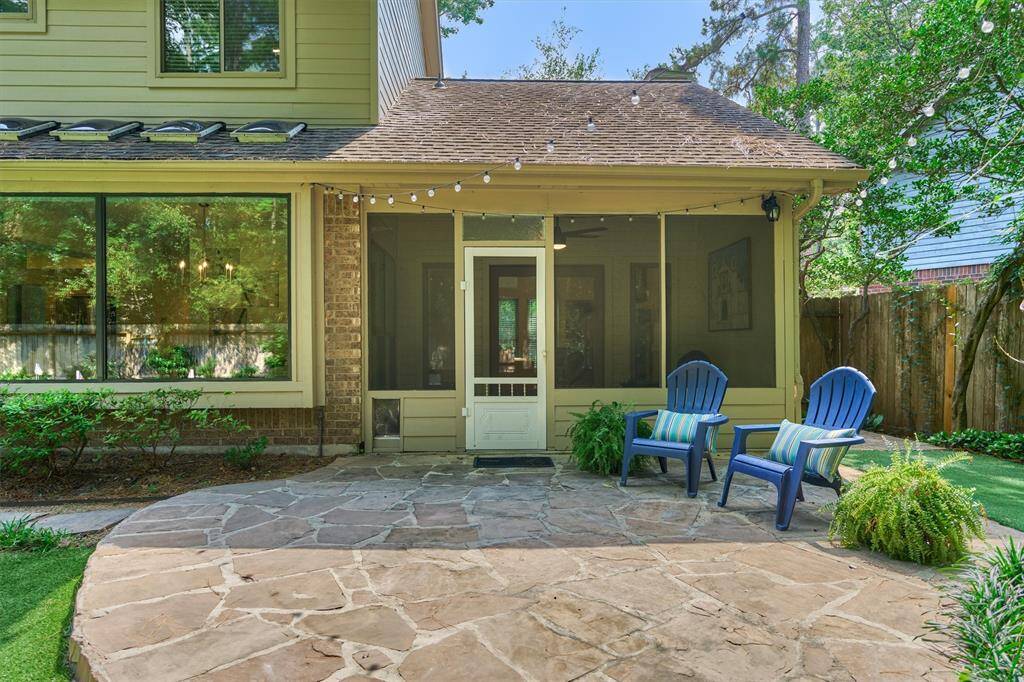 Back view of Screened porch with flagstone patio for enjoying the evening or spectating the putting competition. Mosquito mist system in backyard so you can enjoy without the unwanted pests.