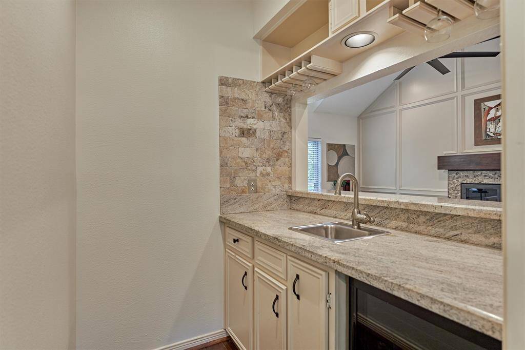 Coffee/Wine/Wet Bar entry is through Dining Room. Complete with sink and beverage refrigerator.
