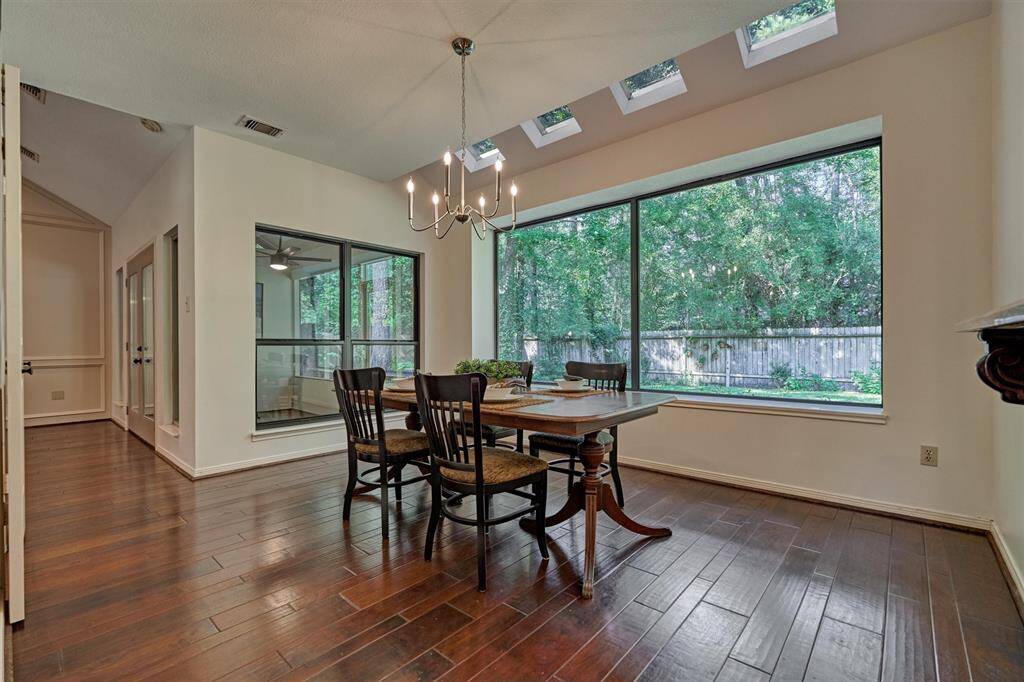 Dining room connects to Family room and Kitchen with views of backyard and Screened porch.