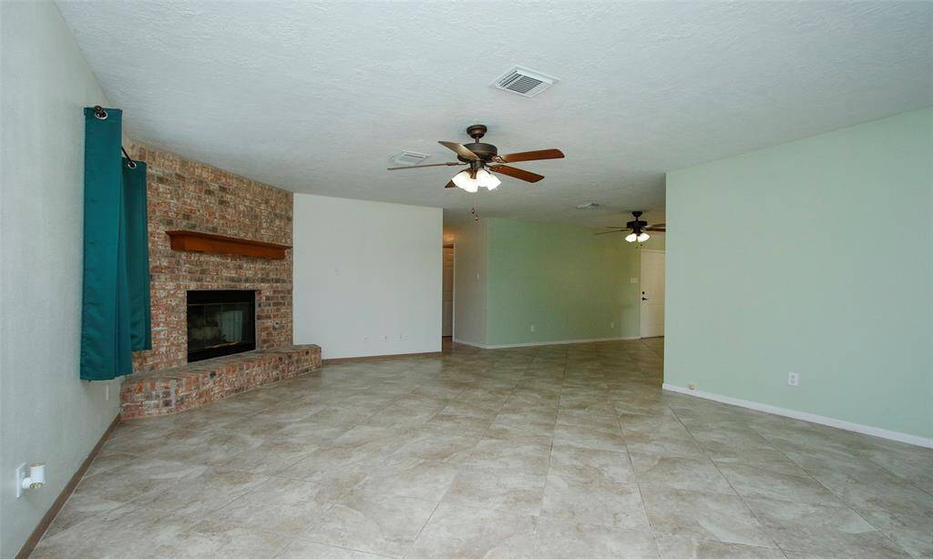 Anchored by the charming brick fireplace, this home is ready to make memories