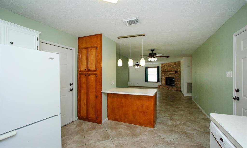Pantry storage next to the breakfast bar