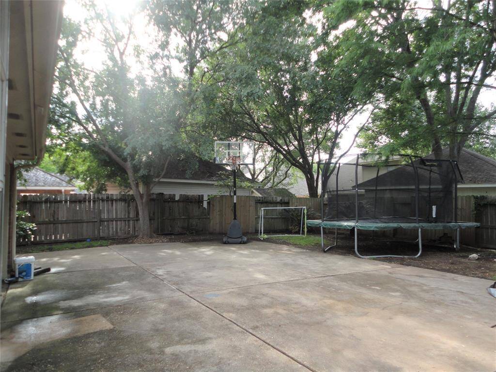 SPACIOUS BACKYARD WITH LOTS OF TREE