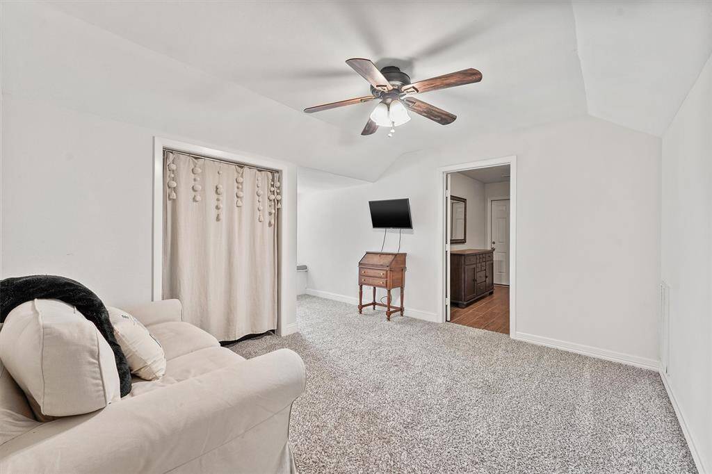 Spacious upstairs guest suite featuring a cozy sitting area —perfect for relaxing, reading, or creating a private retreat for long-term guests.