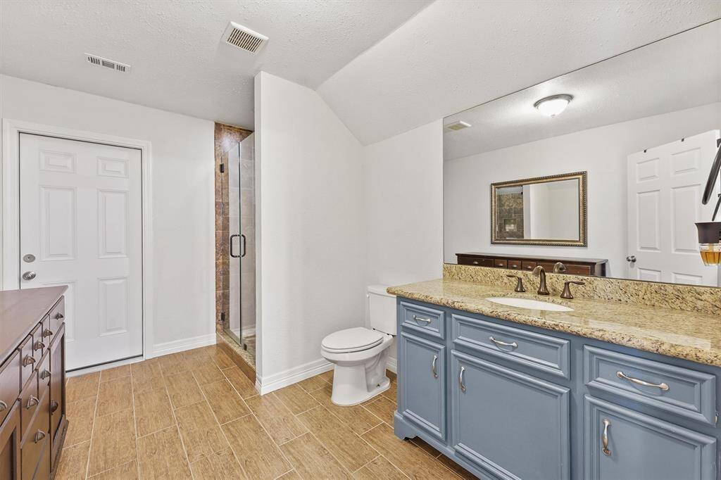 Clean and contemporary design with a large walk-in shower—offering both style and functionality.