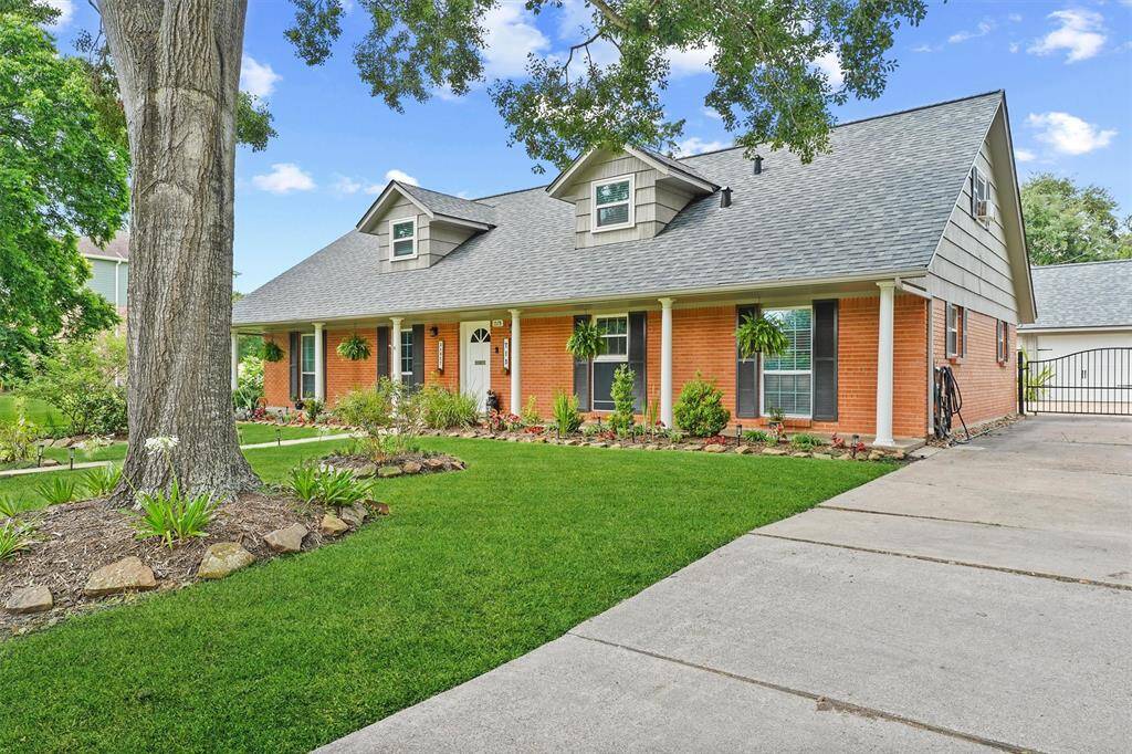 Extra-long driveway with a modern steel gate—offering both curb appeal and secure, private access to the property.