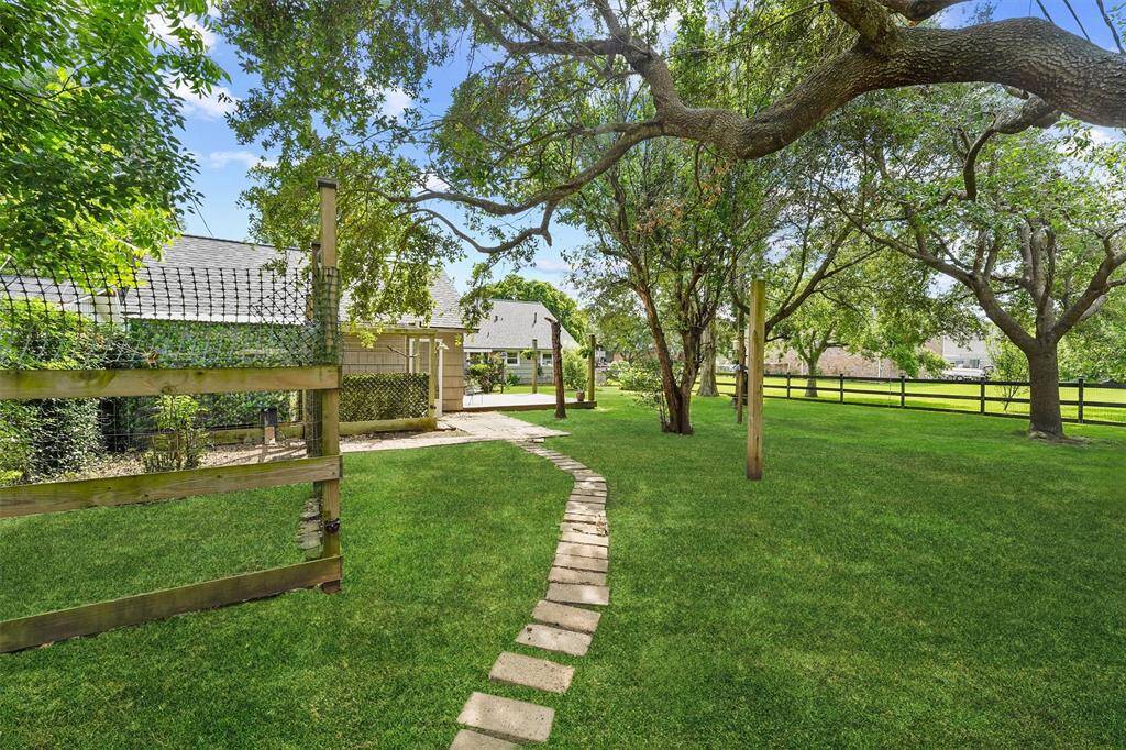 Charming backyard chicken coop included—perfect for farm-fresh eggs and a touch of country living right at home.