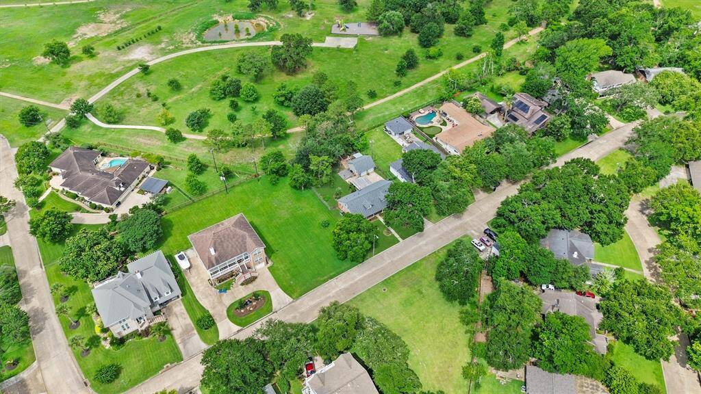 Backing to Taylor Lake Village Park with direct gate access from your backyard—enjoy a scenic walking track, frisbee golf course, open green space, and more right outside your door.