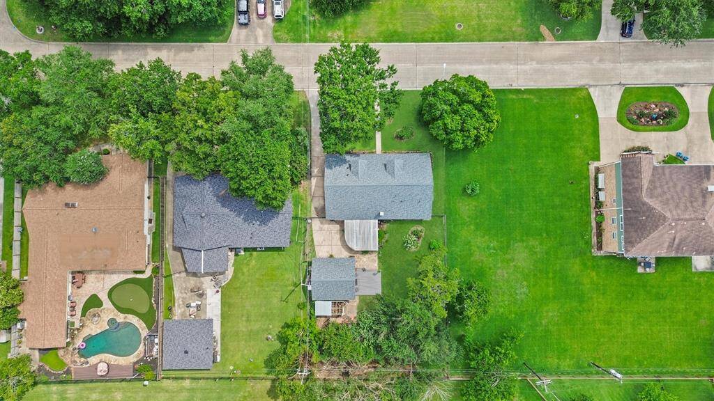 Aerial perspective showcasing the included additional lot—offering expanded outdoor space, added privacy, or future build potential.