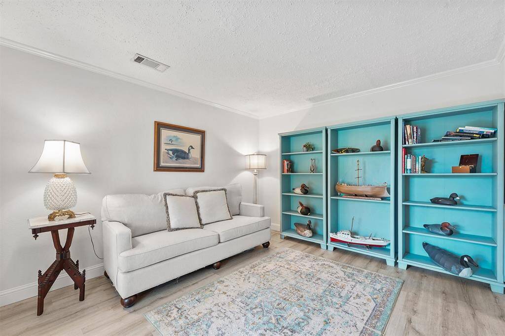 Versatile front room that can function as a dedicated home office, formal living area, or quiet reading retreat—adaptable to fit your lifestyle.