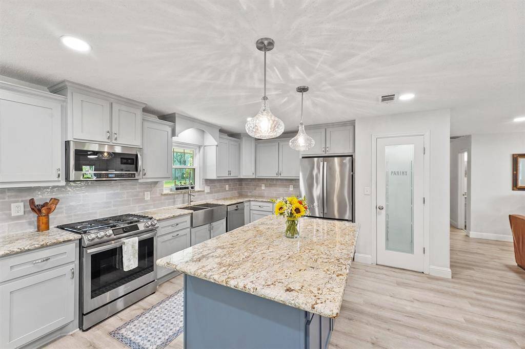 Granite countertop and backsplash detail emphasizing craftsmanship.