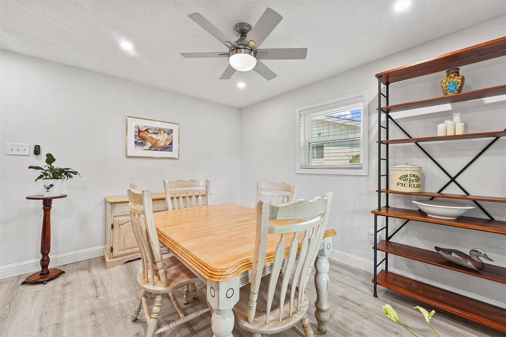 Adjacent dining space with elegant lighting and easy access to the kitchen.